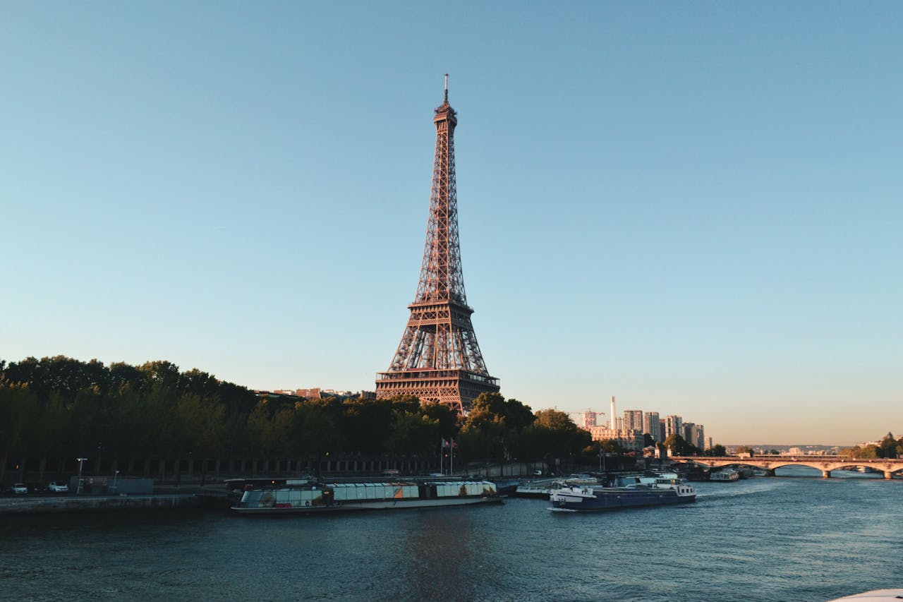 Crafting Captivating Headlines: Your awesome post title goes here Scenic view of the Eiffel Tower and Seine River at sunset, showcasing iconic Parisian architecture.